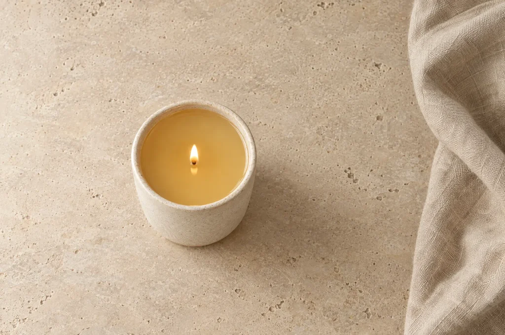 A lit candle with a full, even melt pool