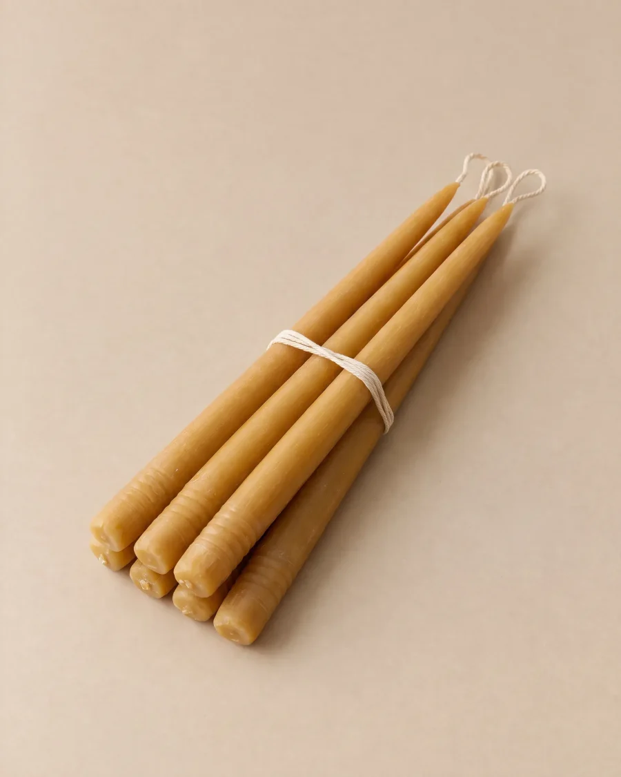 Six hand-dipped beeswax taper candles tied with cotton string